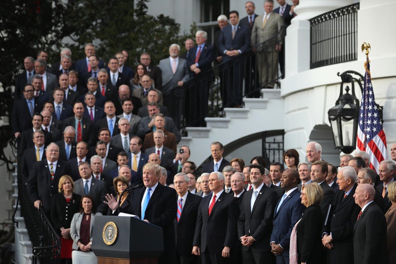 WASHINGTON, DC - DECEMBER 20: U.S. President Donald Trump, flanked by Republican lawmakers, celebrates Congress passing the Tax Cuts and Jobs Act on the South Lawn of the White House on December 20, 2017 in Washington, DC. The tax bill is the first major legislative victory for the GOP-controlled Congress and Trump since he took office almost one year ago. (Photo by Chip Somodevilla/Getty Images)